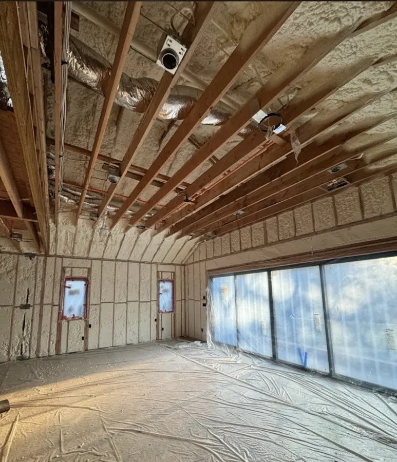 Interior walls and ceiling insulated with spray foam during new construction in Anaheim